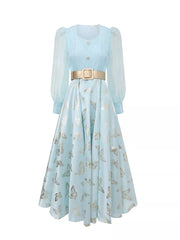 Light blue midi dress with butterfly print, cinched waist, and sheer puff sleeves.