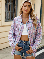 Checkered long sleeve collared shirt in pastel plaid with button front and chest pockets.