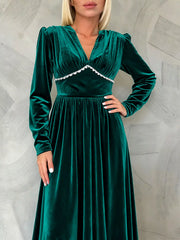 Green velvet ruched V-neck maxi dress with long sleeves and scalloped trim.