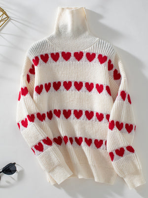 Cream turtleneck sweater with red heart intarsia pattern, acrylic knit.