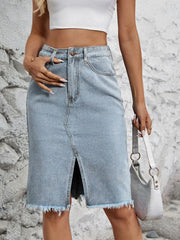 Light blue denim pencil skirt with front slit and frayed hem.