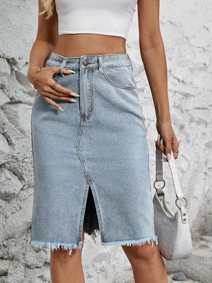 Light blue denim pencil skirt with front slit and frayed hem.