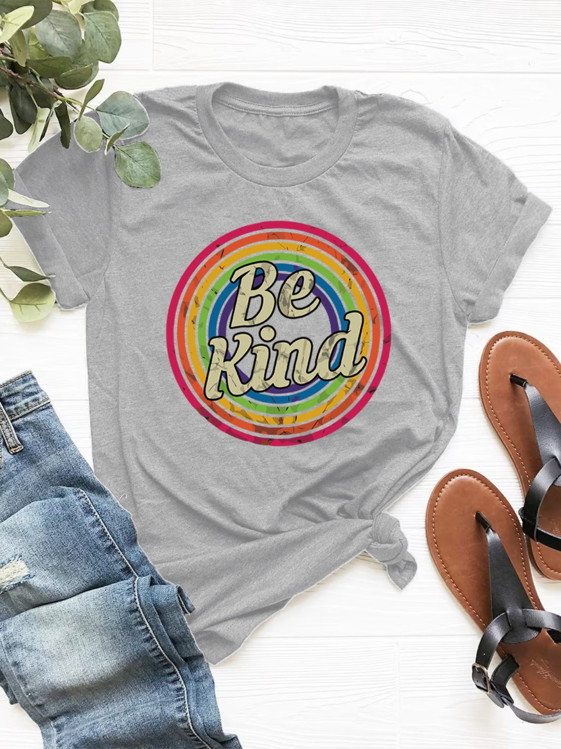 Gray graphic t-shirt with retro "Be Kind" rainbow circle design