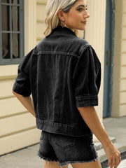 Black cropped denim jacket with puff sleeves and button details.