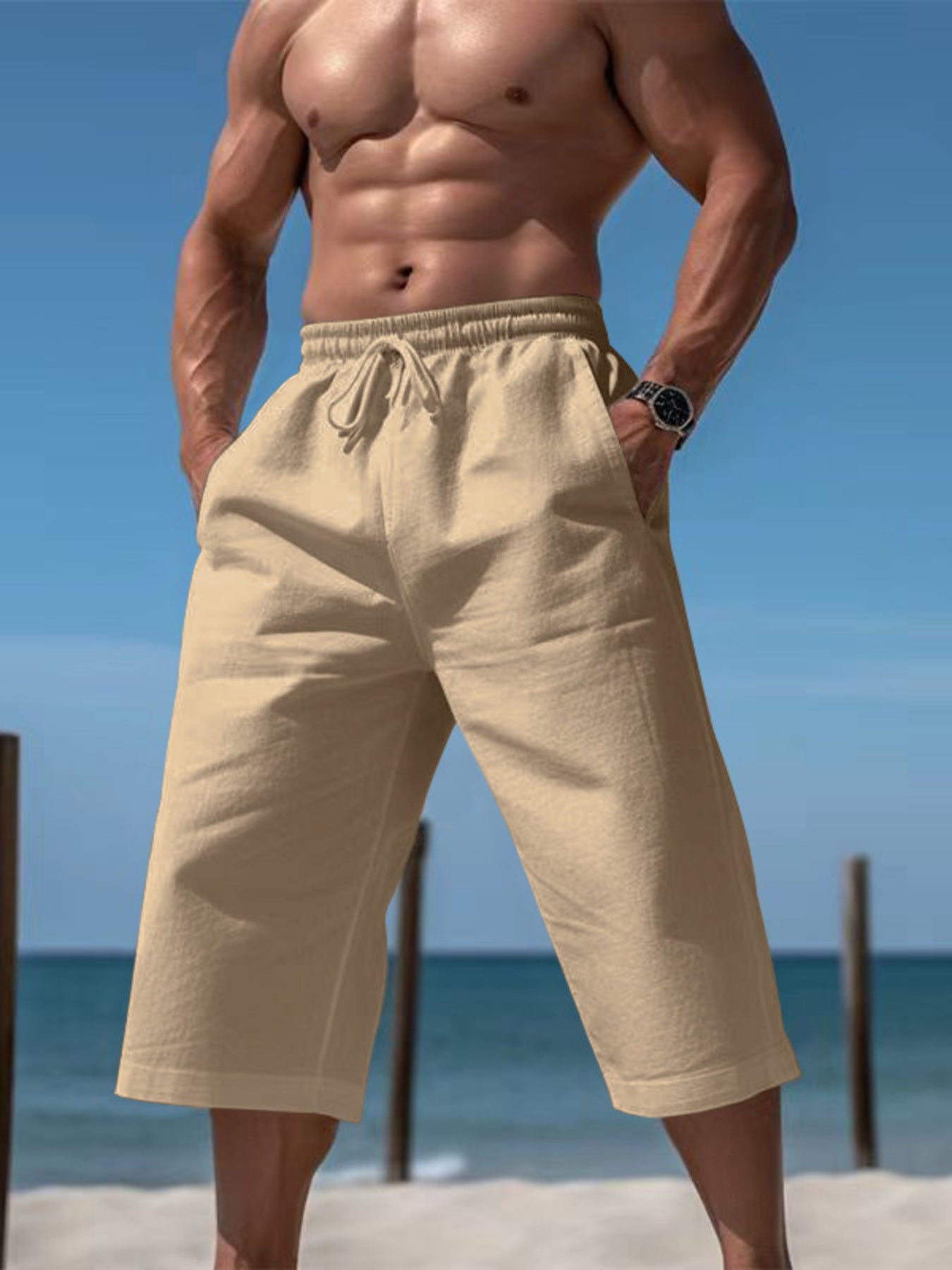 Relaxed fit cropped sweatpants in earthy yellow with drawstring waist and pockets.