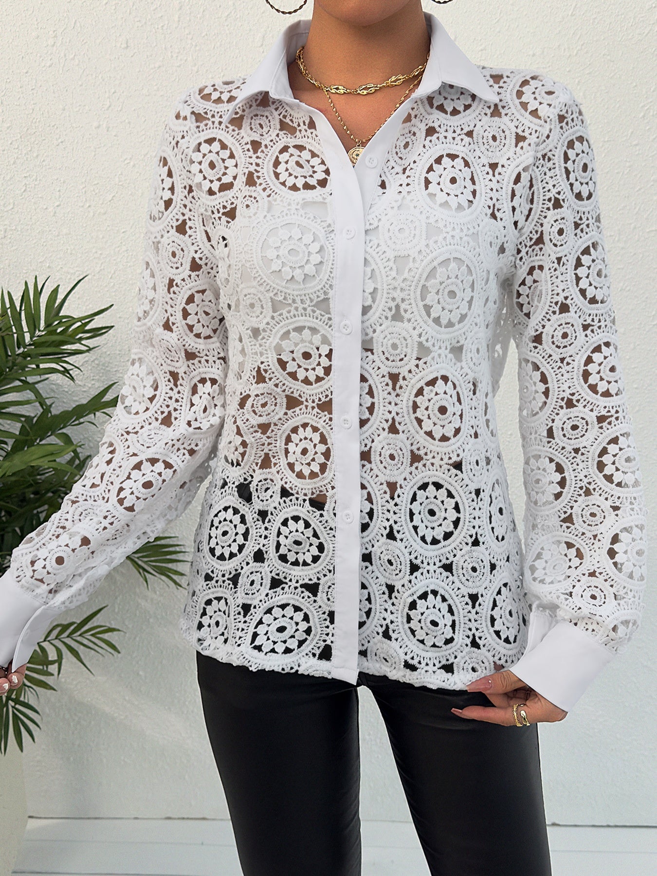 White lace cutout button-up shirt with classic collar and long sleeves