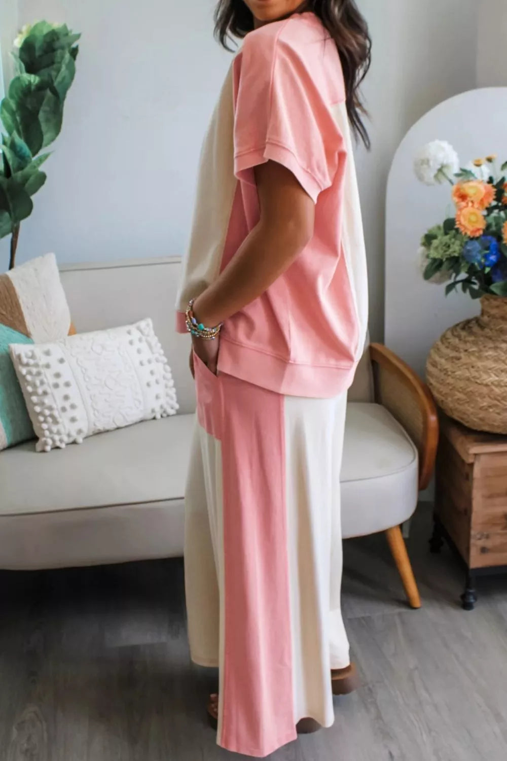 Chic color block lounge set in cream and pink cotton with short sleeves and wide leg pants.
