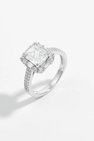 Silver radiant emerald cut halo ring with pave band and baguette accents
