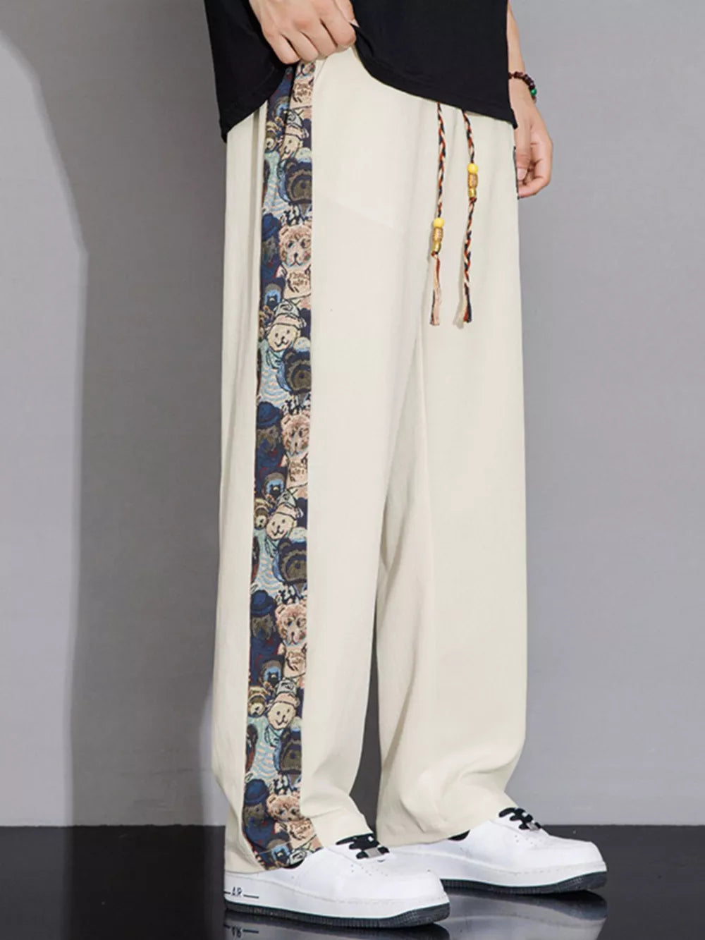 Men's eggshell sweatpants with printed side stripe and drawstring detail