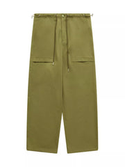 Relaxed fit cargo trousers in yellow-green with drawstring waist and utility pockets.