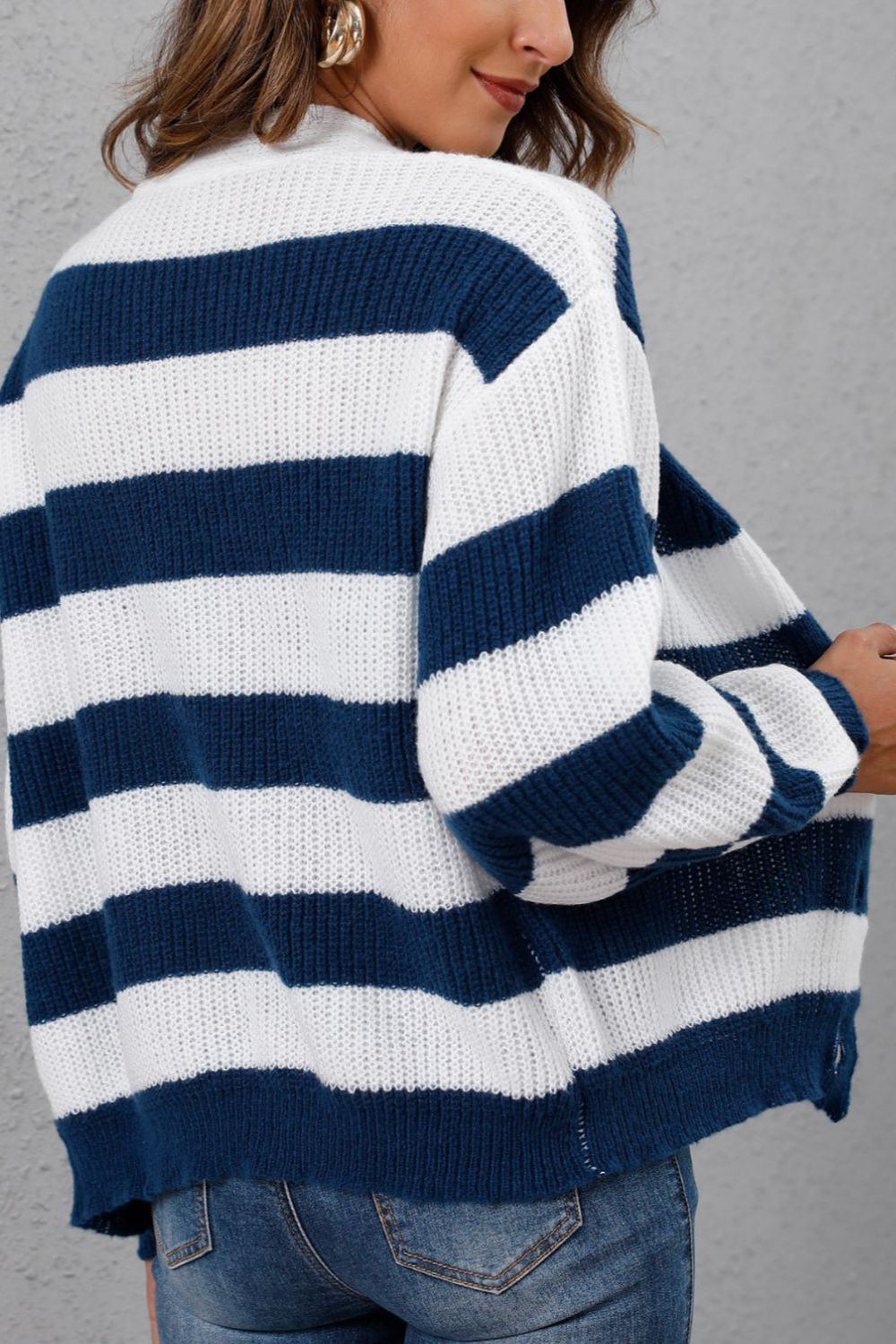 Chunky stripe cardigan with balloon sleeves in navy and white acrylic knit.