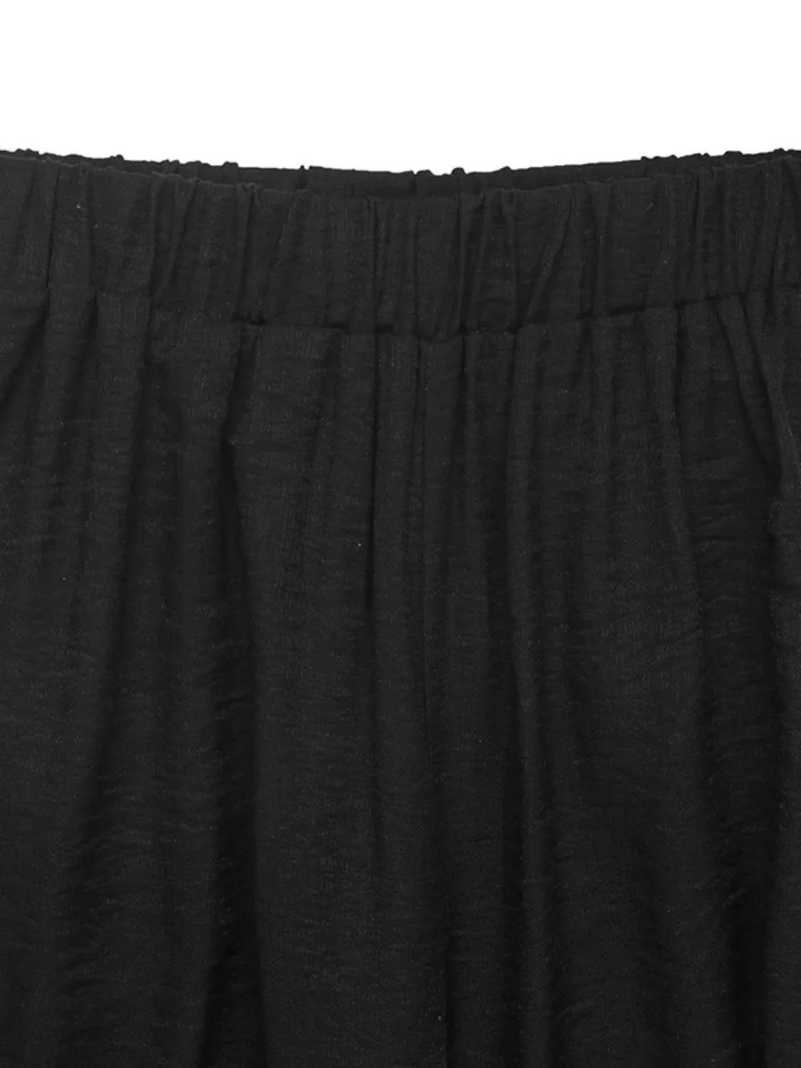 Black wide leg pants with elastic waistband and textured fabric