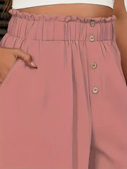 Pale blush wide-leg pants with paperbag waist and button detail