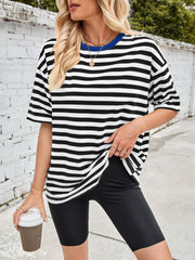Relaxed fit t-shirt with black and white stripes and a blue contrast neck.