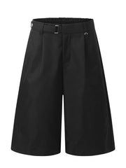 Black pleated wide-leg maternity capris with elastic waistband and buckle detail.