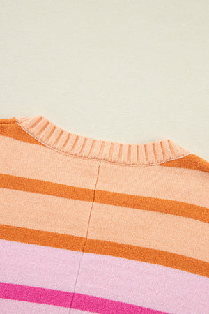 Ombre stripe knit sweater with ribbed neckline in sherbet and pink tones.