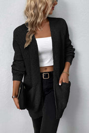 Black waffle knit longline cardigan with pockets, open front, and long sleeves.
