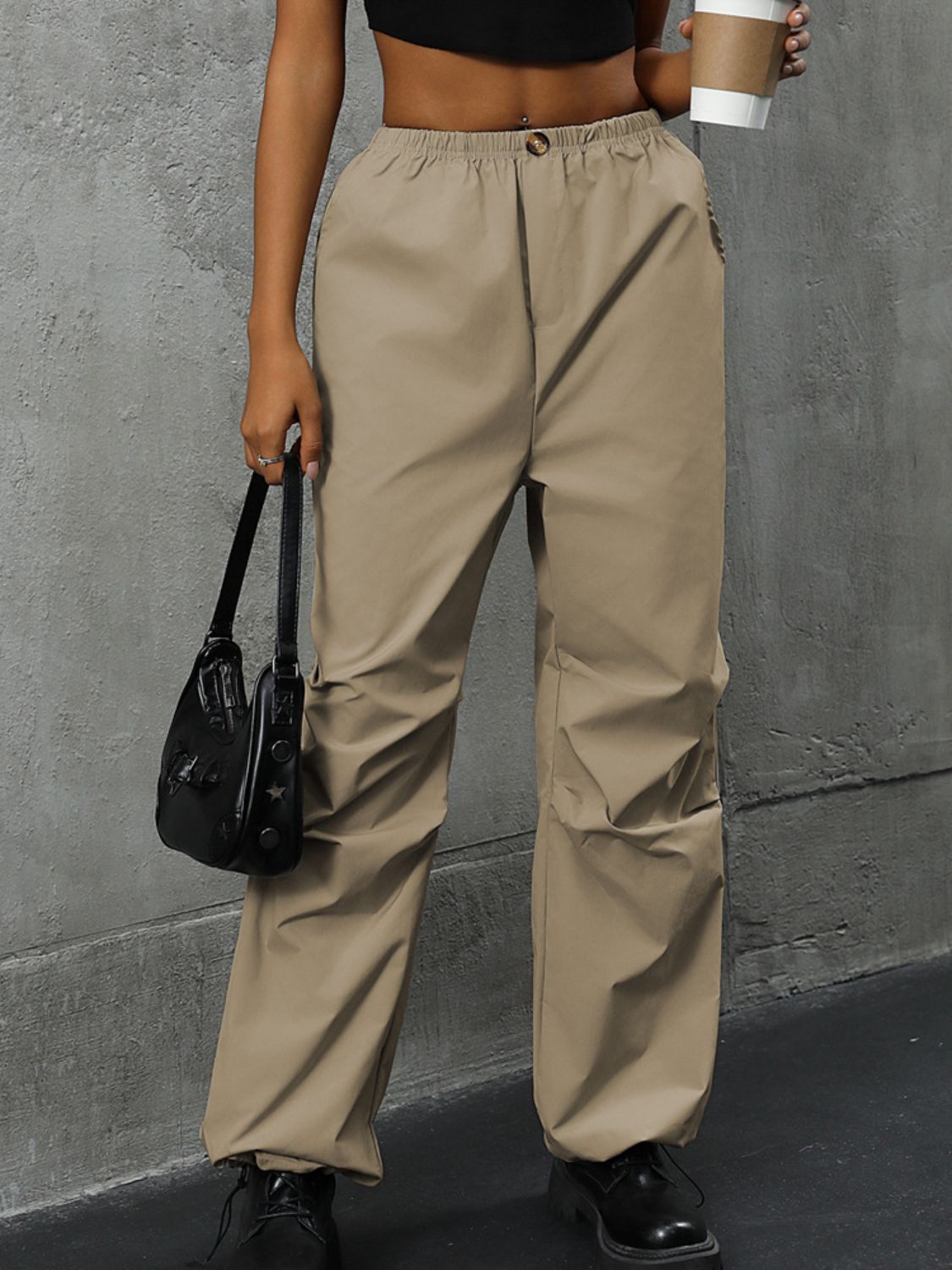 Khaki gathered-leg utility trousers with elasticated cuffs and a relaxed fit.