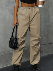 Khaki gathered-leg utility trousers with elasticated cuffs and a relaxed fit.