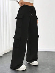 Black relaxed fit cargo pants with drawstring and multiple flap pockets.