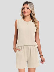 Apricot ribbed knit set with sleeveless top and pocketed shorts.