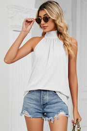 White high neck halter tank top with ruched detail and a bow back detail.