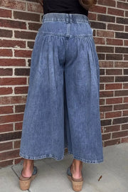 Maternity wide-leg jeans in blue denim with a high-waisted, elasticized back and pleated front.