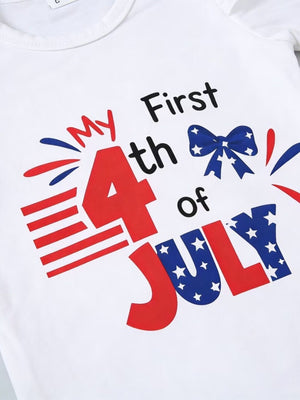 White baby t-shirt with patriotic "My First 4th of July" graphic and bow detail.