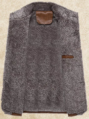 Men's grey fleece lined sport jacket interior with brown leather details.