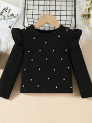 Toddler black ribbed long sleeve top with pearl embellishments and ruffled shoulders.