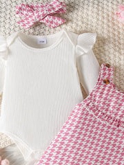 White ribbed bodysuit with ruffled sleeves and pink houndstooth dress with bow headband
