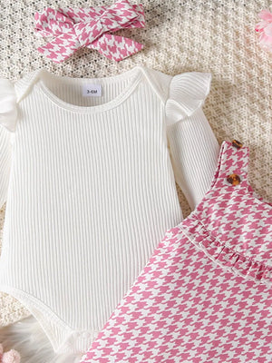 White ribbed bodysuit with ruffled sleeves and pink houndstooth dress with bow headband
