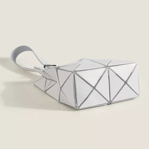 White mini geometric panel tote bag with unique folded design and single strap.