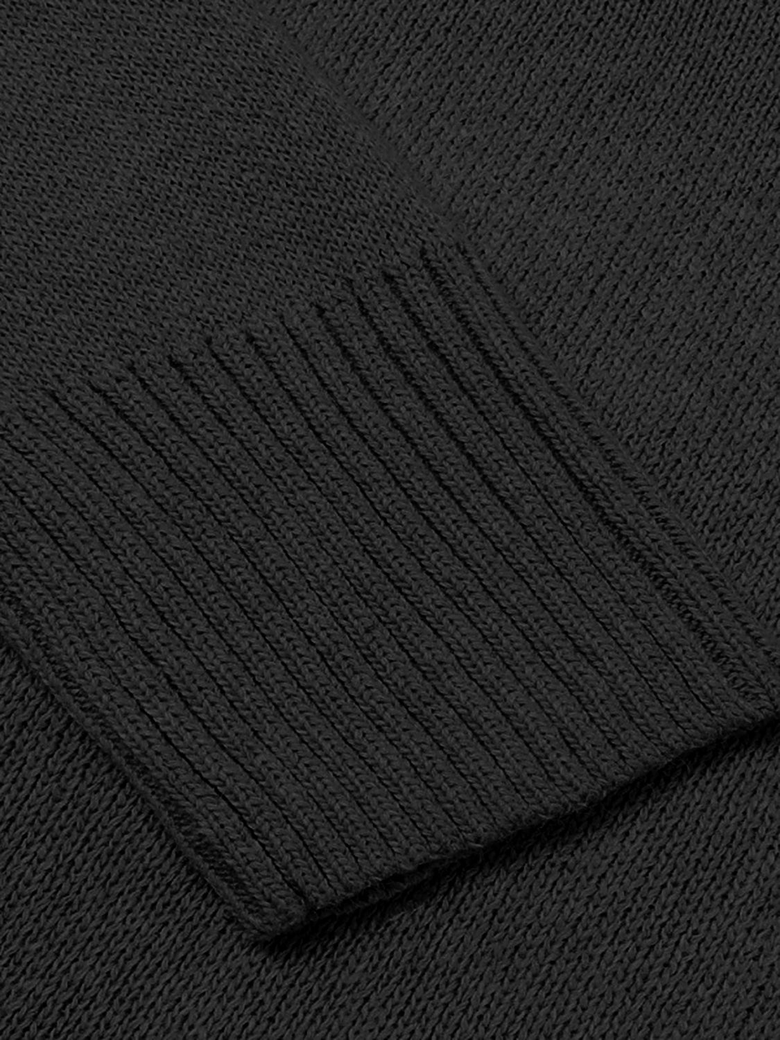 Black knit sweater with ribbed trim detail on cuff