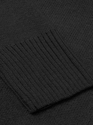 Black knit sweater with ribbed trim detail on cuff