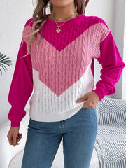 Chevron cable knit sweater in pink and white with contrast sleeves.