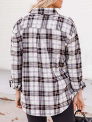 Relaxed fit plaid button-down shirt in white with black and pink plaid.