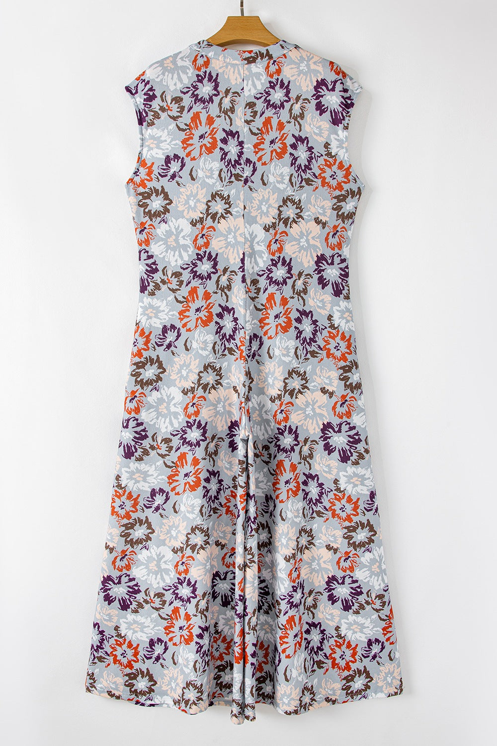 Floral cap-sleeve wide-leg jumpsuit with a button detail and a vintage floral print.