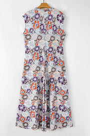 Floral cap-sleeve wide-leg jumpsuit with a button detail and a vintage floral print.