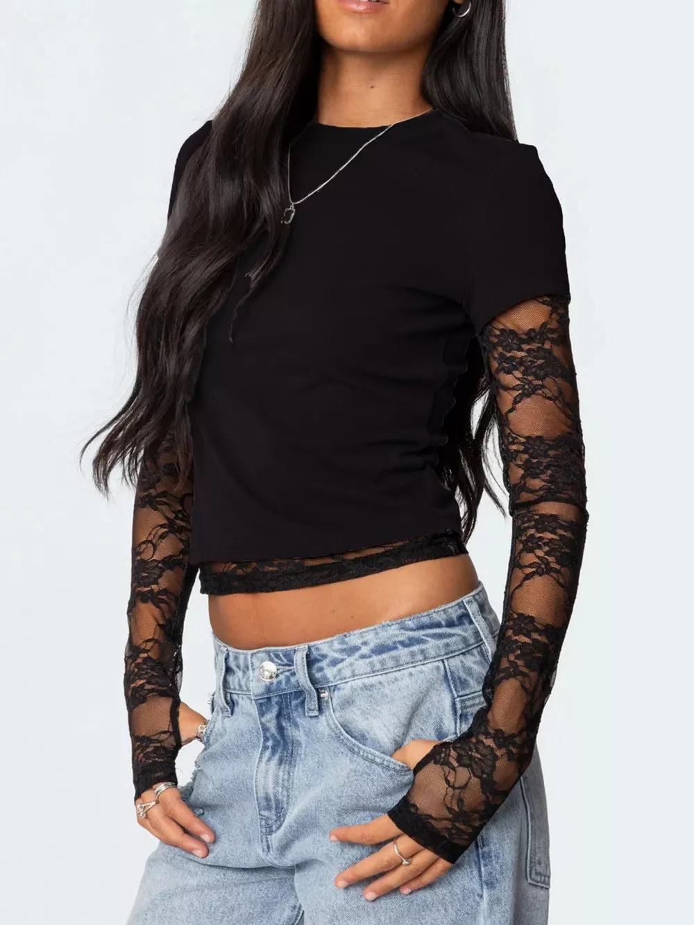 Black cropped t-shirt with lace sleeves and hem detail.