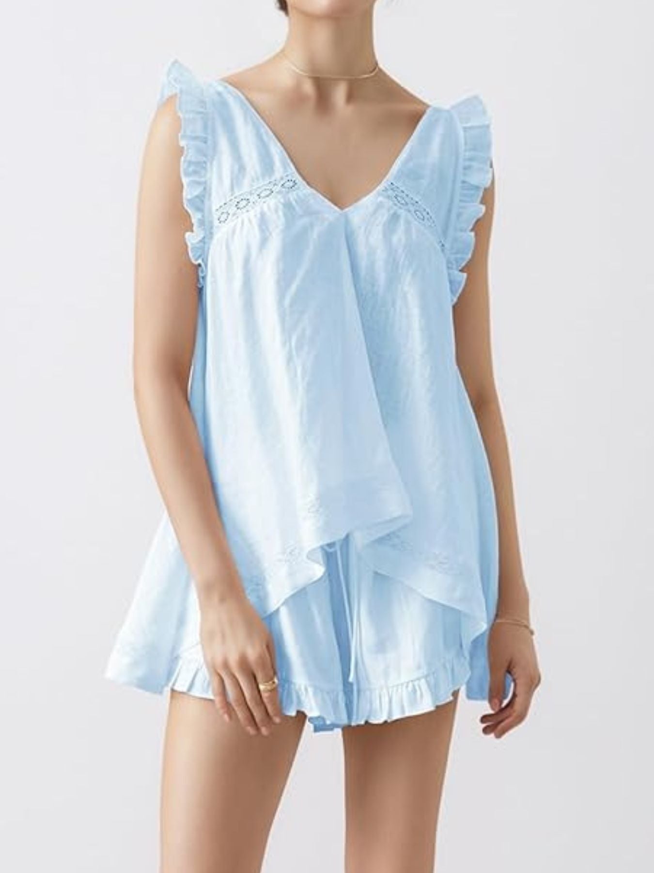 Light blue ruffled V-neck top and shorts set with lace trim and tiered hem.