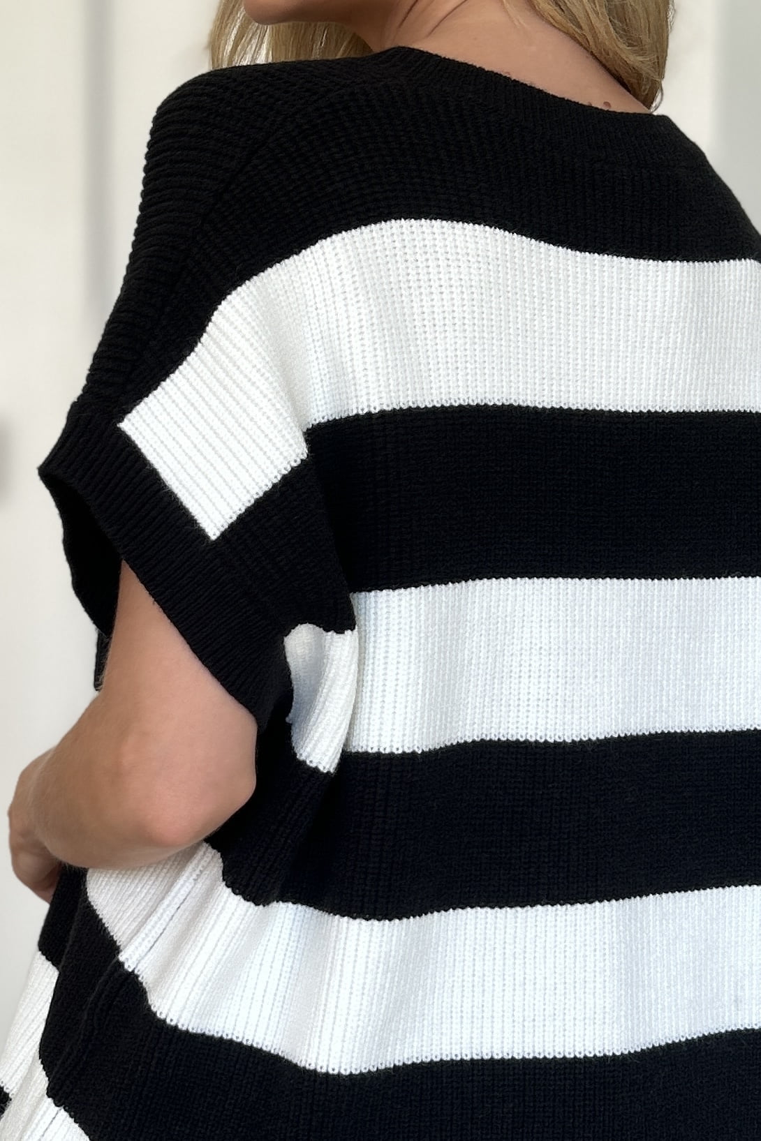 Black and white striped knit top with cap sleeves.