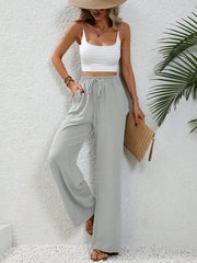 Light gray textured palazzo trousers with drawstring waist and wide leg