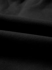 Black cotton joggers with a textured knit detail.