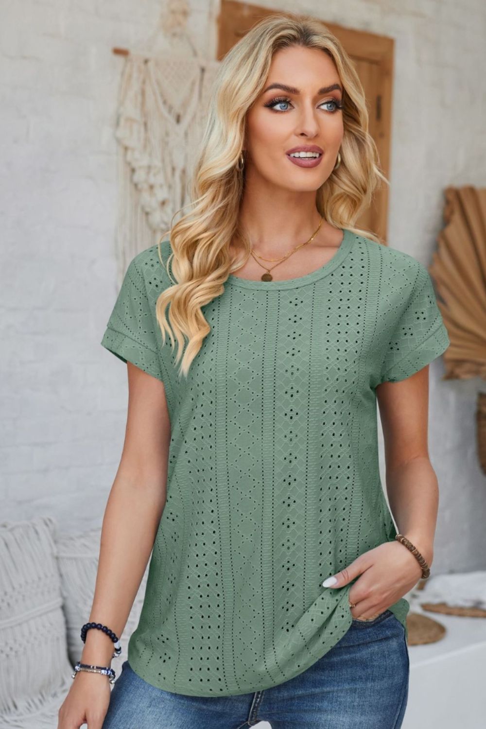 Sage green perforated eyelet tee with cuffed short sleeves and crew neck.