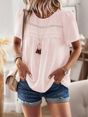 Blush pink textured puff sleeve yoke blouse with lace trim and short sleeves.