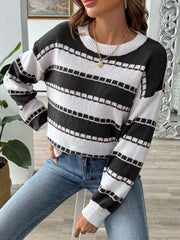 Textured stripe crewneck sweater in black and white with a ribbed neckline and cuffs.
