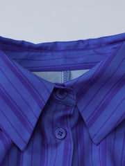 Button-down mini dress in blue with purple stripes, featuring a collar and visible buttons.