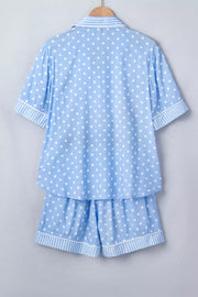 Blue polka dot viscose pajama set with white stripes on collar, cuffs, and hem.