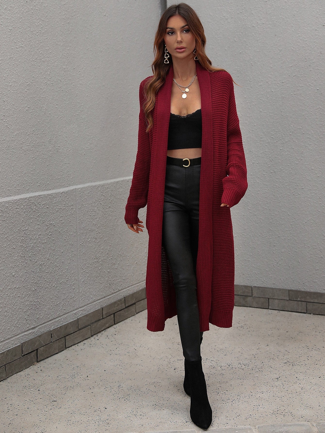 Textured knit maxi cardigan in wine with open front and long sleeves.